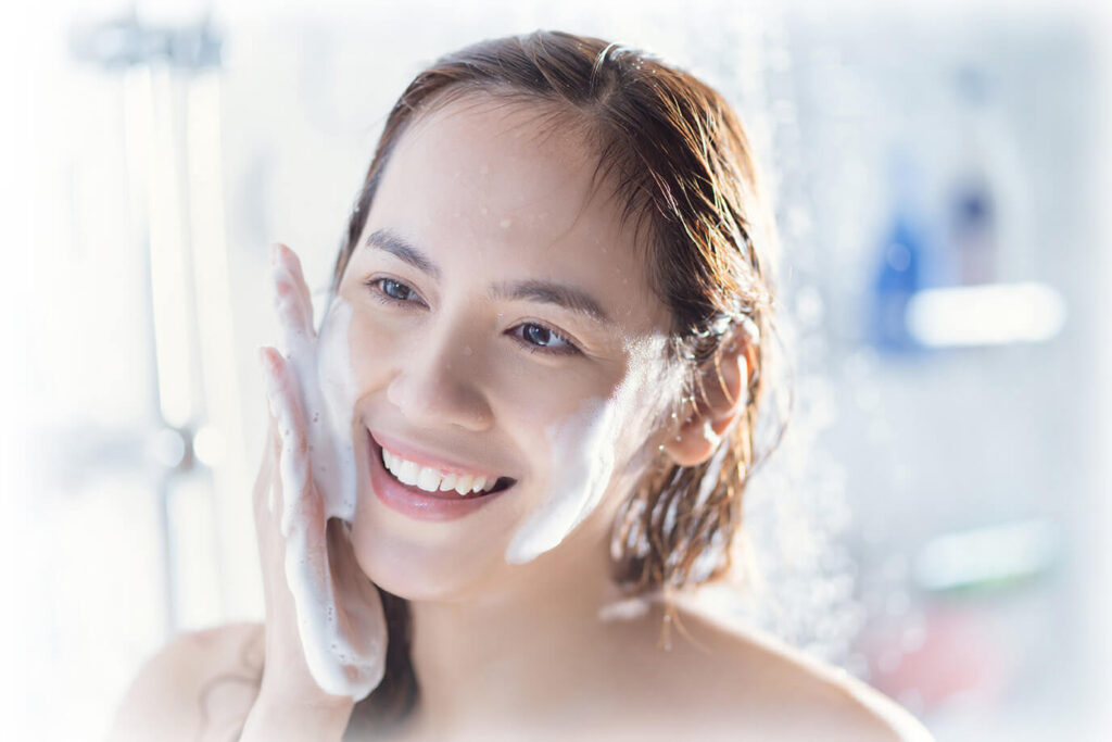 Woman Using Derma Cleanser Mousse